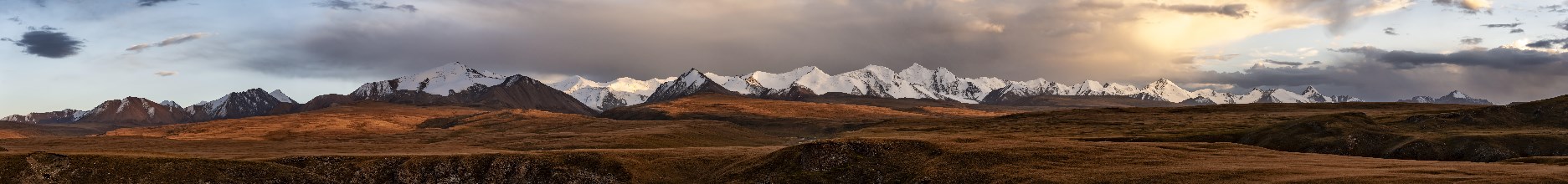 Panorama, Glaciated and snow-capped mountains, dramatic mountain landscape at sunset, autumnal