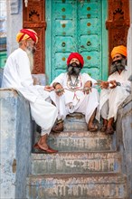 Three traditional men with turban having a talk, Jodhpur, Rajasthan, India, Asia