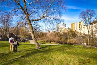 Couple with dog in Central Park, Manhattan, New York City