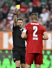 Referee Patrick Ittrich shows Waldemar Anton VfB Stuttgart (02) yellow card, yellow card, caution,