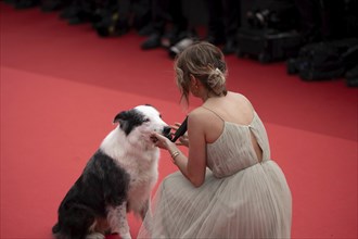 Cannes, France, 14 May 2024: Laura Martin Contini and Messi the Dog during the opening of the 77th