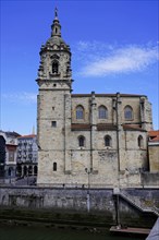 The church Iglesia de San Anton at the river Nervion in Bilbao, Historic church with stone bell