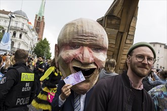 Dancer dressed as an investor from the 100% Tempelhofer Feld group at the street parade of the 26th