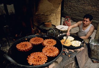 Jalebi cooking, sweet prepared in the street, Patan, Nepal, Asia