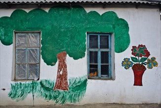 Decorated outer wall of a house, house owned by a nizari ismaili family, painting to commemorate