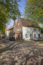 Crossroads and historic brick buildings with gables in Friedrichstadt, Nordfriesland district,