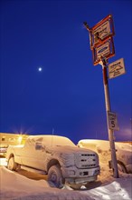 Car dealer, snow-covered cars, twilight, Deadhorse, Alaska, USA, North America