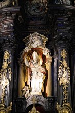 Iglesia San Nicolas de Bari, Baroque statue of a saint with detailed carvings in a church, Old