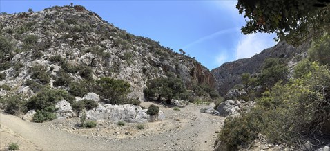 View of hiking trail for trekking in Agiofarago Gorge of the Saints on south coast of Crete island,