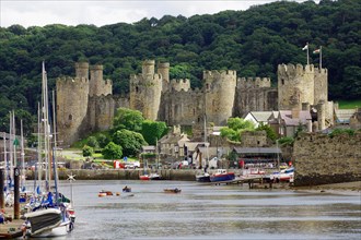 View of a harbour and the towers and walls of a medieval castle, Conwy, Cornwall, Great Britain