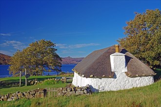 Typical old thatched cottage on the Isle of Skye, holidays, Scotland, Great Britain