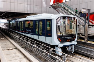 Driverless train Macao Light Rapid Transit at the airport public transport stop in Macau, China,