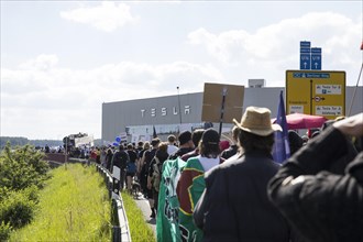 Participants walk to the Tesla Gigafactory during the demonstration Water. Forest. Justice against