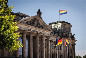 Rainbow flags fly at the Reichstag building to mark the International Day against Homo-, Bi-,
