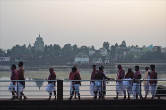 High caste hindus are walking along the lake Bindu, brahmins have performed a hindu ritual,