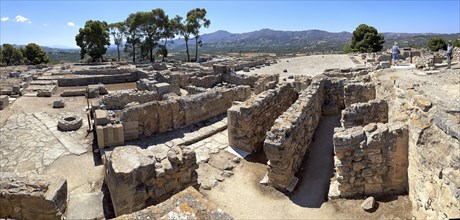 Panoramic view of foundation walls north of in the background central court In archaeological site