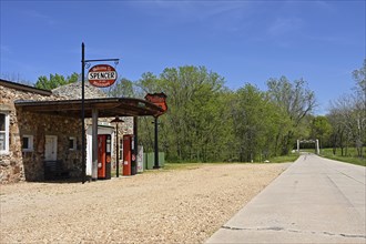 A remote stretch of historic Route 66 passes a lonely petrol station in Spencer, Missouri