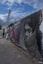 Germany, Berlin, 21.04.2024, Sunday afternoon in Mauerpark, graffiti wall, face of a woman with a