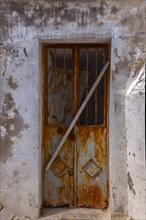 Rusty iron door at a house entrance, Vejer, Andalusia, Spain, Europe