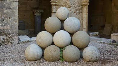 Stone pyramid made of cannonballs in an old fortress, outdoor area, Archaeological Museum, Old