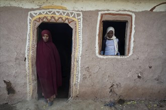 Muslim mother and daughter at home in the Oromia state, Ethiopia. The husband drowned in the