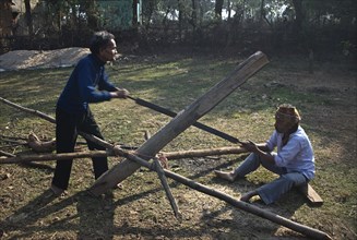 Pitsawyers at work, sawing wood in West Bengal, India, Asia