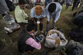 Barpeta, India. 6 May 2024. Polling officials check Electronic Voting Machines (EVMs) before