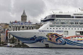 The colourfully painted cruise ship 'Norwegian Spirit' in front of the Galata Tower in Istanbul,