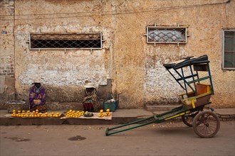 Women selling oranges, rickshaw, Ambalavao, Madagascar, Africa