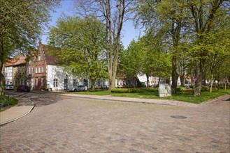 The Great Bridge with gabled houses and cobbled street in Friedrichstadt, North Friesland district,