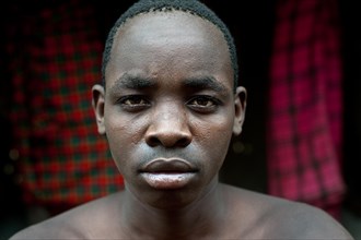 Teenage boy following his initiation rite, portrait of a teen from the Turkana tribe, Kenya, Africa