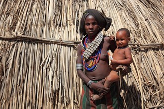 South Ethiopia, in a village of the Arbore or Erbore people at Lake Stefano, young woman with baby