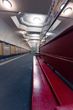Empty underground station with red benches and bright lighting, Berlin Airlift, Germany, Europe