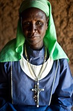 Portrait of a lay woman belonging to the Legio Maria church, an african initiated church, a new