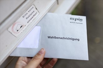 A letter for the election notification for the European elections taken in front of a letterbox in