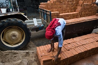 Worker putting bricks on the ground, masonry work, jharkhand, India, Asia