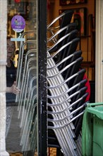 On the way in Bilbao, Province of Bizkaia, Basque Country, Spain, Europe, Stacked chairs in a shop,