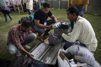 Barpeta, India. 6 May 2024. Polling officials check Electronic Voting Machines (EVMs) before