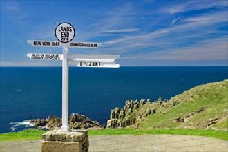Signpost at Lands End, cliffs and sea, New York, John O Groats, Cornwall, Great Britain