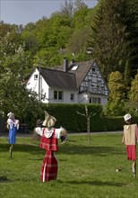 Scarecrows at the parish hall of the Protestant church in Unterburg, Solingen, Bergisches Land,