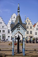 Historic swing pump on the market square in Friedrichstadt, North Friesland district,