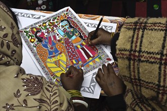 Women taking drawing lessons in a drawing school, learning the Madhubani style of painting, Bihar,
