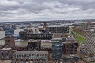 City view with modern buildings and harbour area on a cloudy day, view from above of a modern city