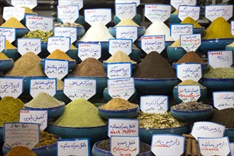 Various spices such as cardamom, fennel, pepper, nutmeg and lemon powder are offered at a bazaar in