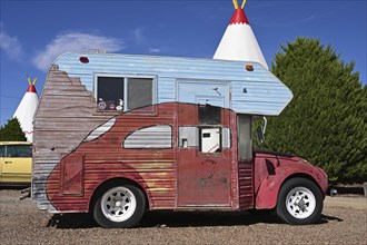 Antique VW Beetle camper adorns the backyard of the Wigwam Motel on Route 66, Holbrook, Arizona