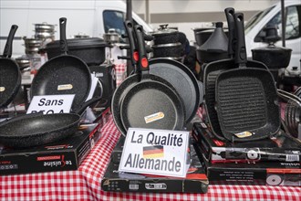 Pans and pots, La Qualite Allemande sign, Made in Germany, market, Montparnasse, Paris, France,