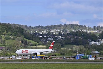 Airport construction site Fly Swiss, Boeing 777-300ER, HB-JNE, Zurich Kloten, Switzerland, Europe