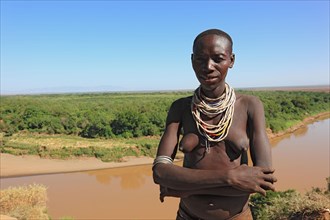 South Ethiopia, Omo region, Omo river landscape, proud woman of the Karo people with necklace,