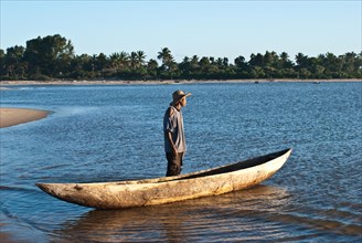 Pirogue and boatman, Pangalanes canal, Madagascar, Africa