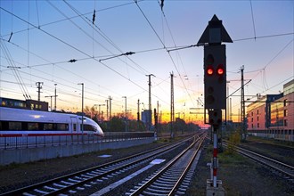Intercity-Express at the atmospheric sunrise at the main railway station in Dortmund, Germany,